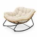 Fauteuil à bascule en métal et rotin avec coussin beige
