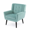 Fauteuil en velours vert menthe avec pieds en bois