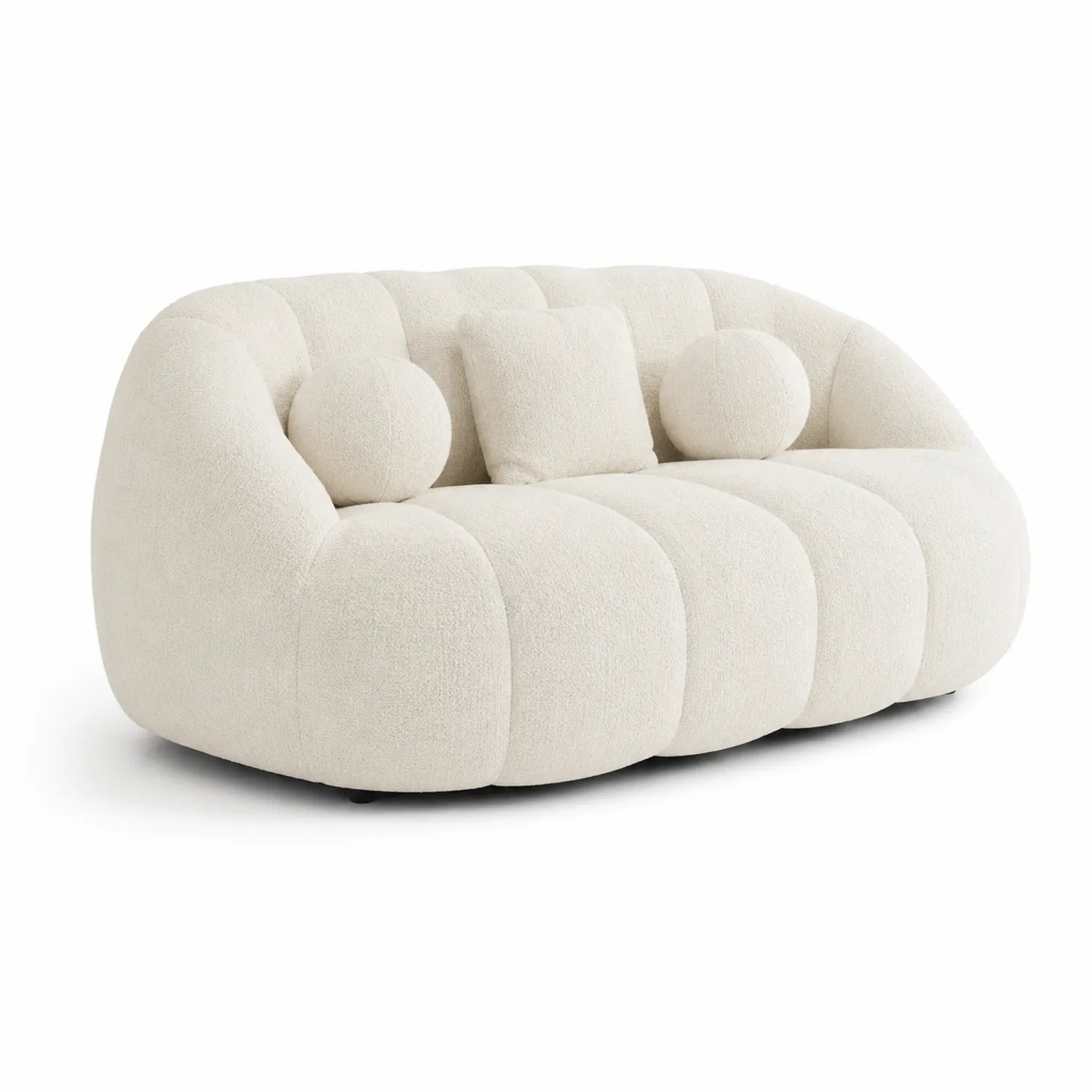 Canapé en tissu bouclé beige avec coussins